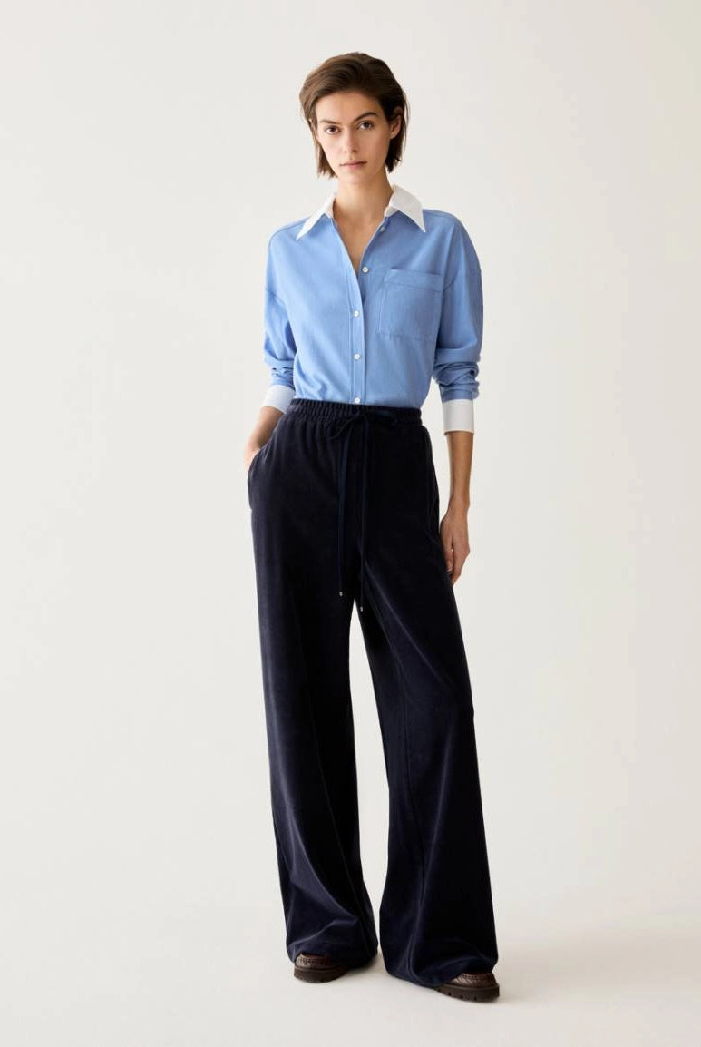 Pennyblack Vischio navy relaxed wide-leg trousers styled with a blue shirt – full model view