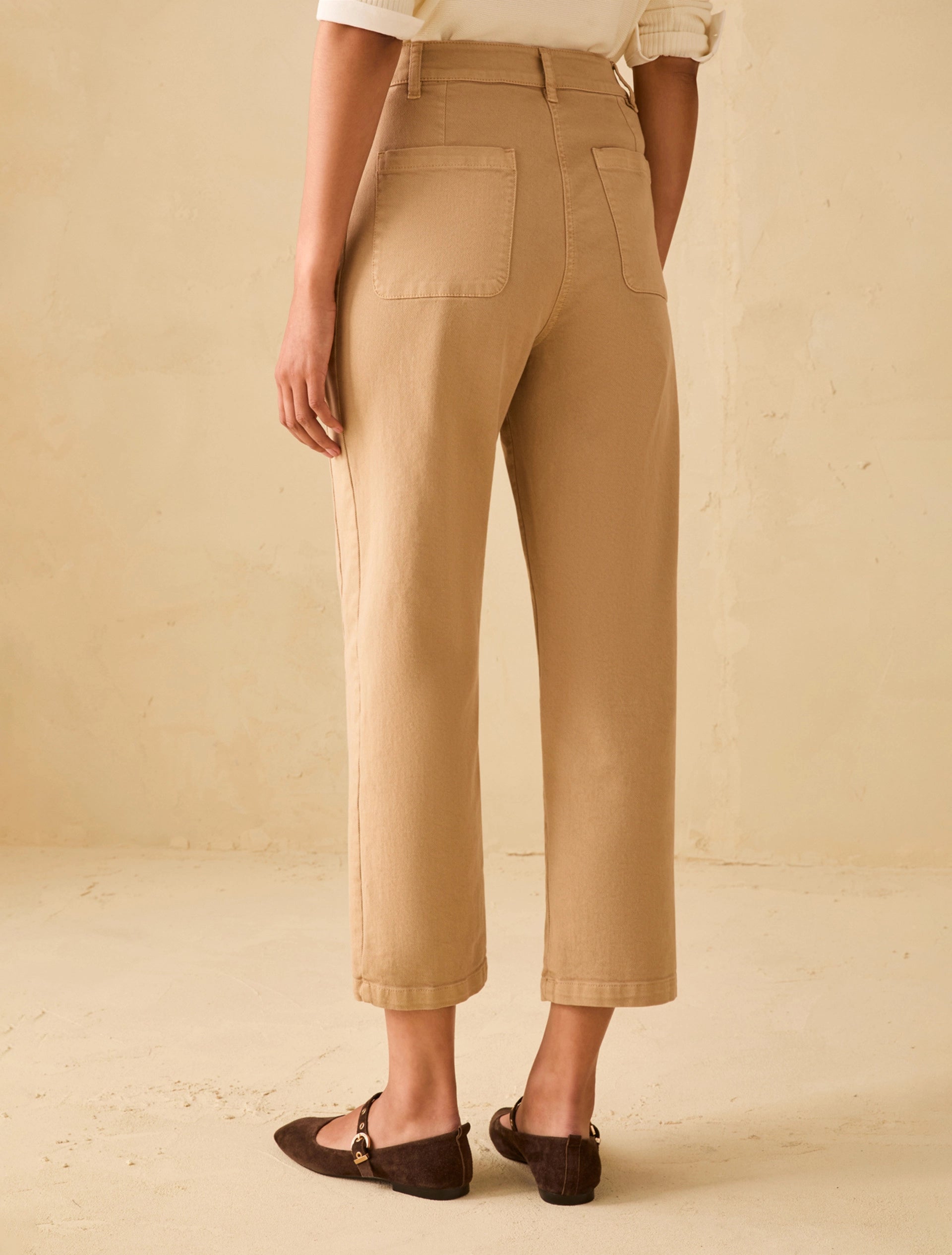 Straight leg cotton denim trousers camel back view with patch pockets