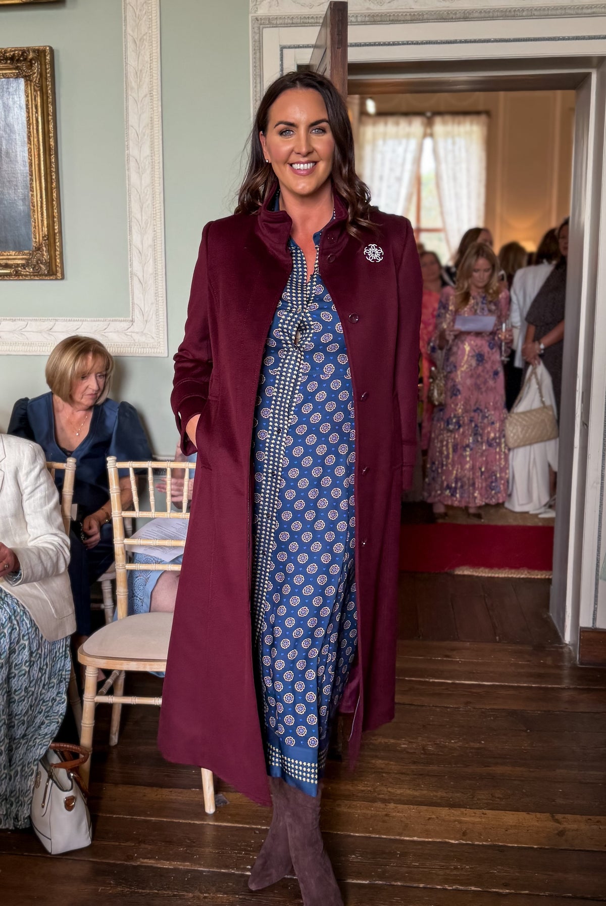 Pennyblack Corsaro burgundy long tailored coat styled over printed midi dress