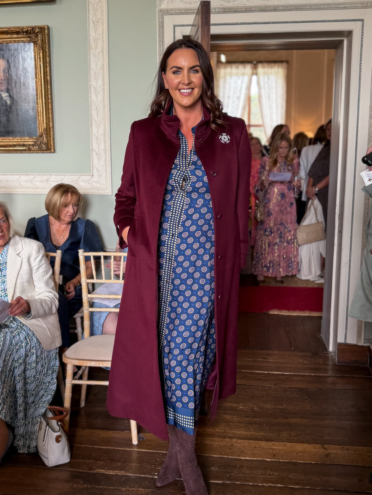 Pennyblack Corsaro burgundy long tailored coat styled over printed midi dress