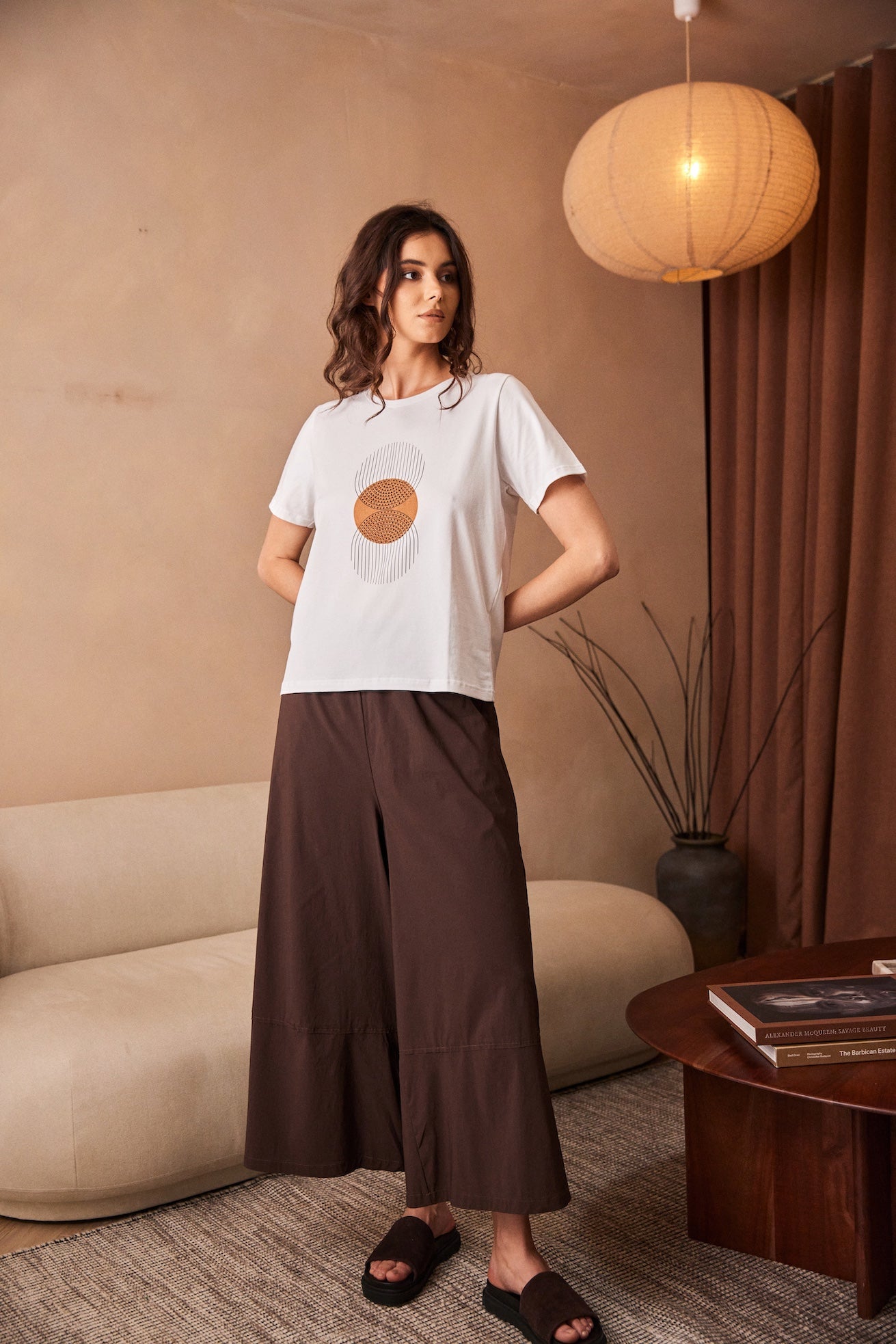 Peruzzi Circle Line Graphic Print Top styled with wide leg trousers for casual wear