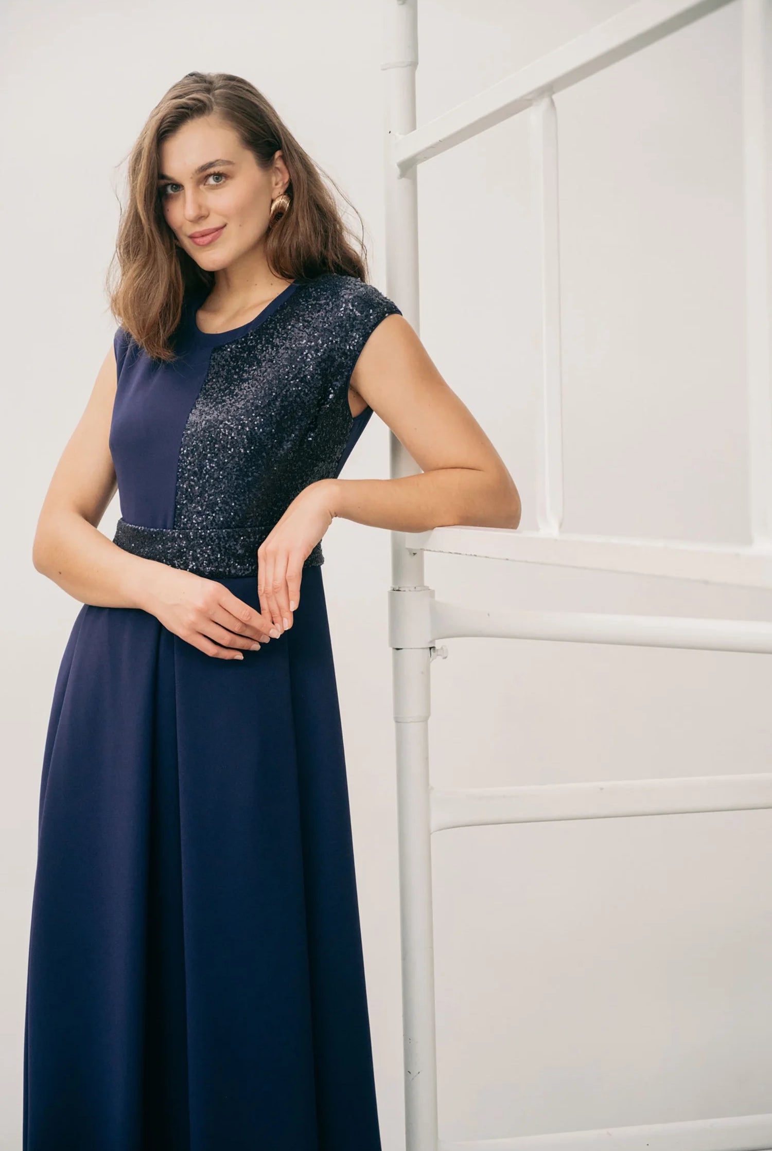 Three-quarter view of Sisters Feya Feya dress with full flowing midi skirt