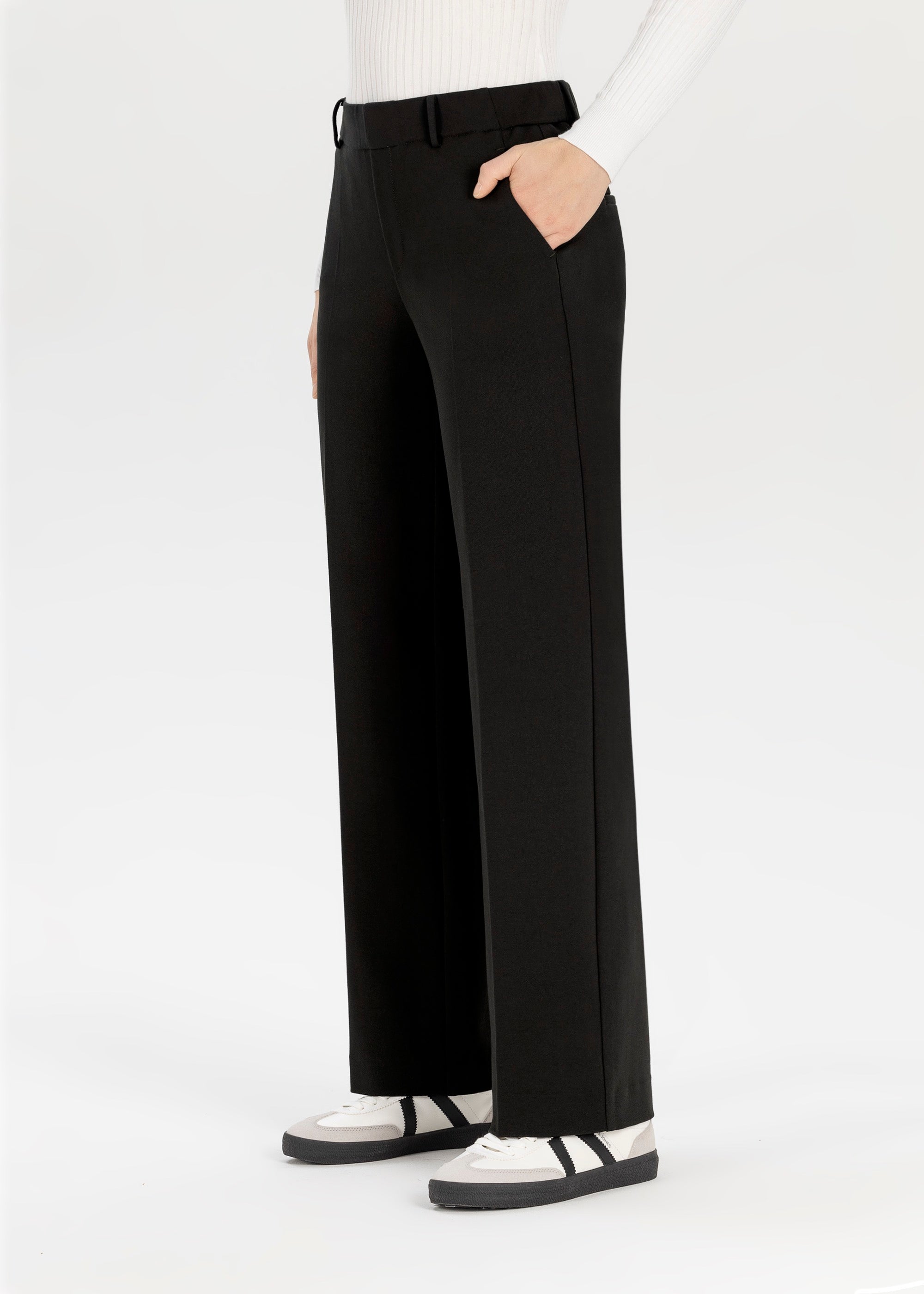 Side profile showing drape and wide-leg silhouette of Fenja2 pull on trousers