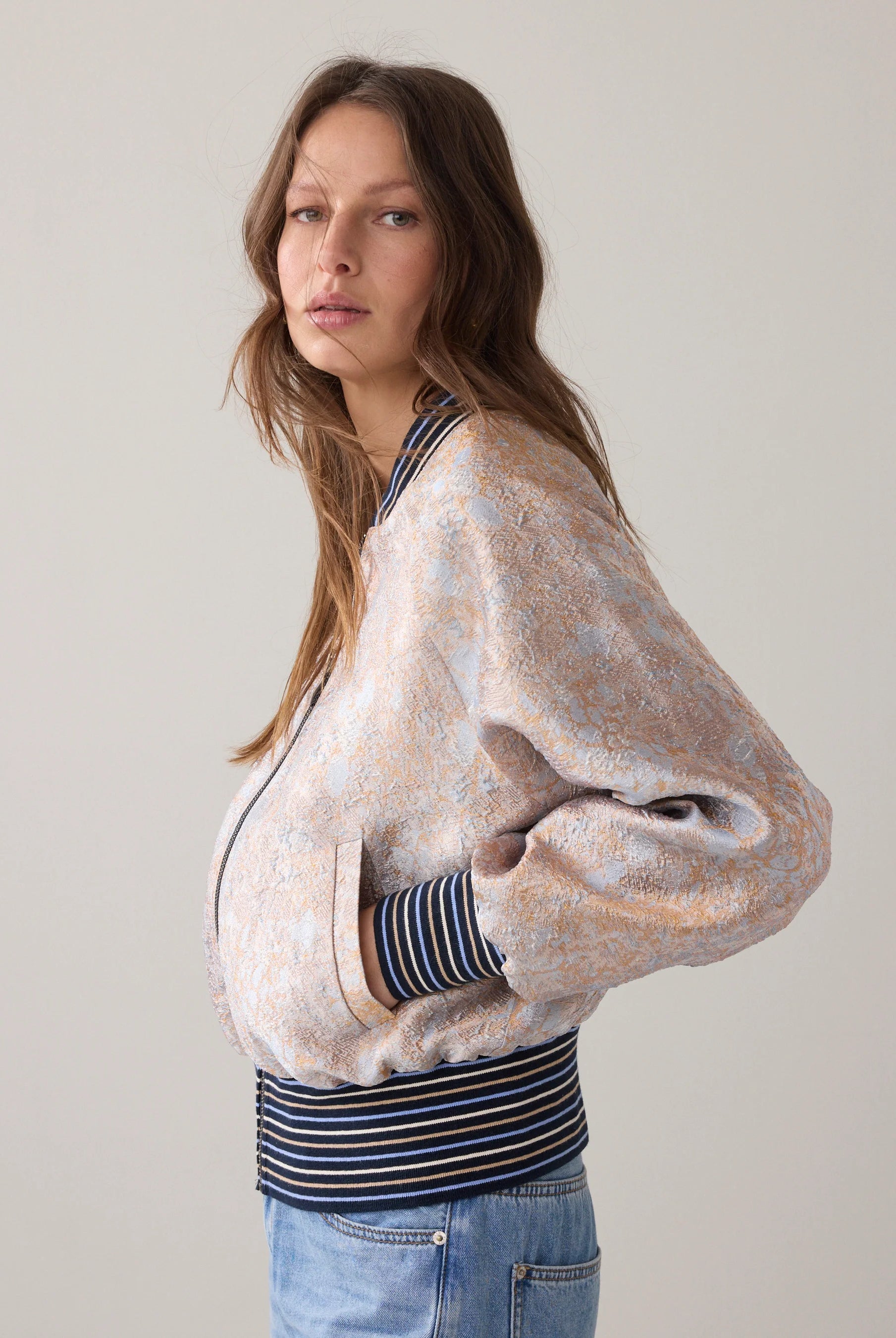 Summum jacquard bomber jacket side view showing striped hem detail