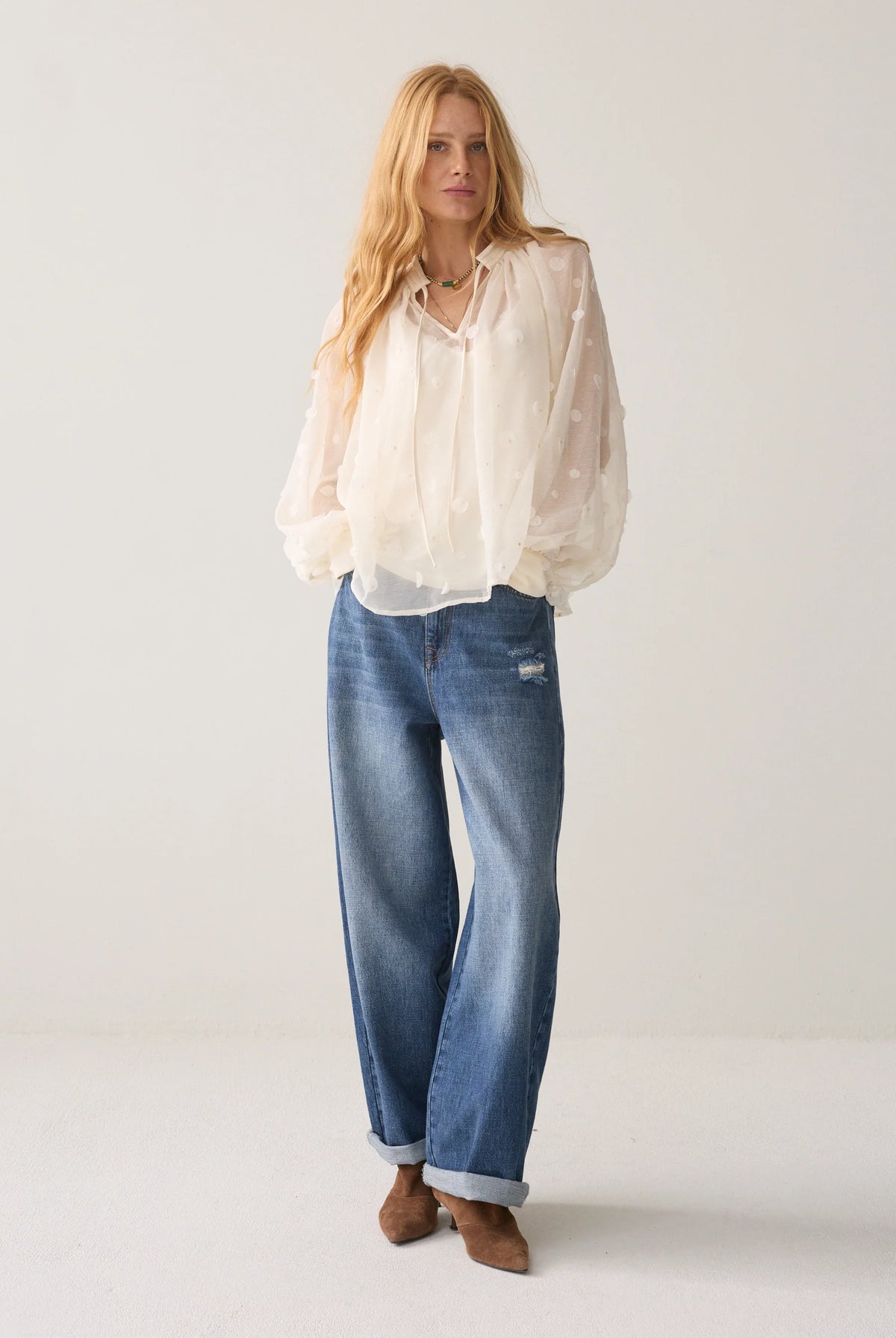 Summum cream sequin and bead blouse – full-length model view with jeans