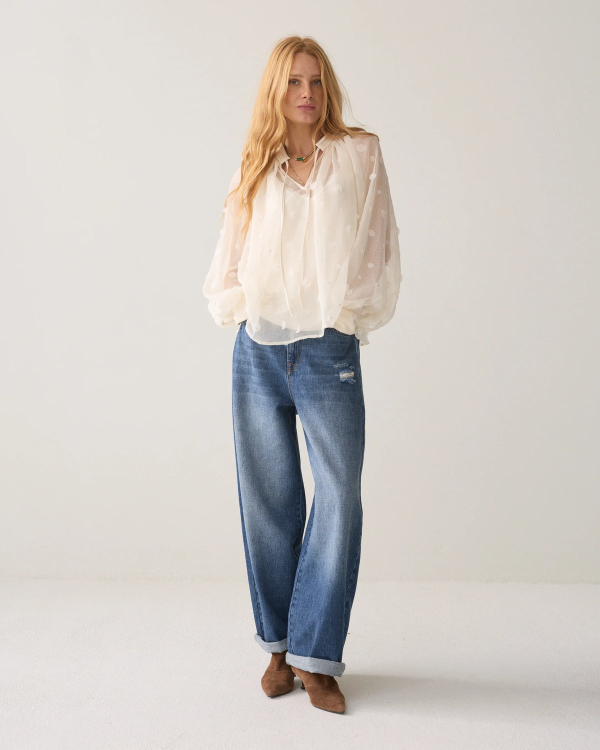 Summum cream sequin and bead blouse – full-length model view with jeans