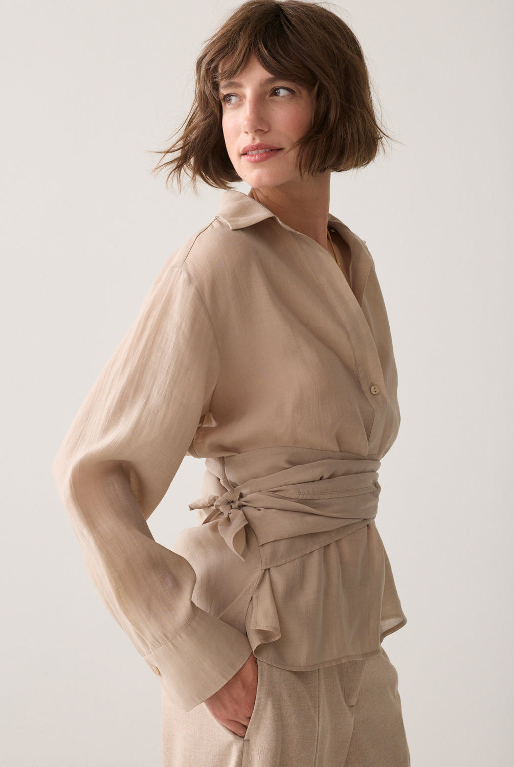 Side view of Summum sand wrap tie blouse