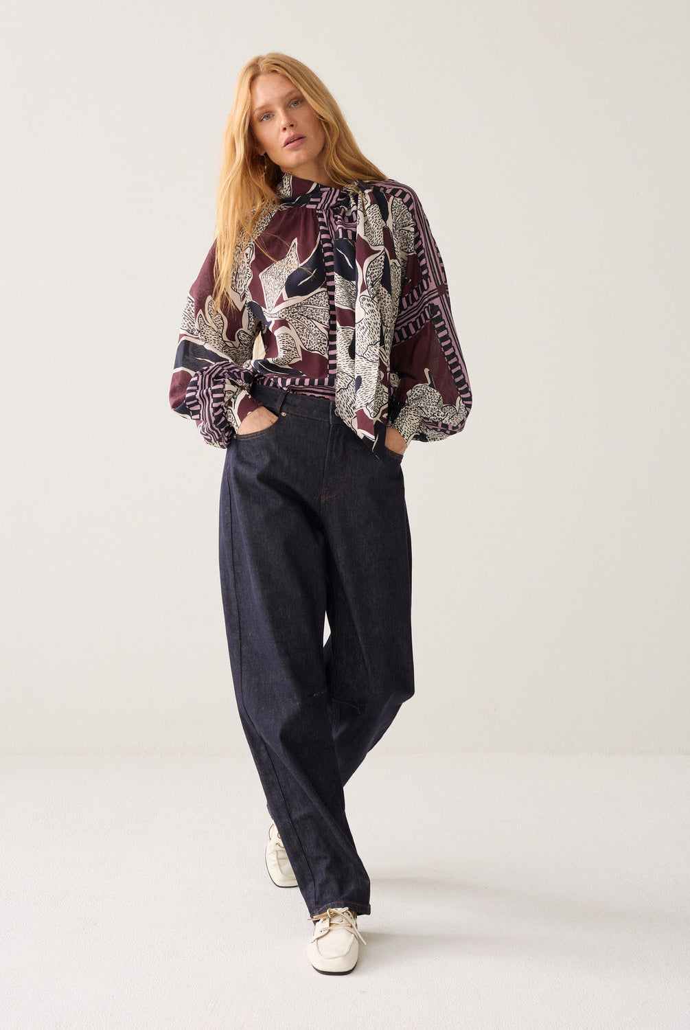 Women’s Summum floral print bow blouse styled with dark trousers