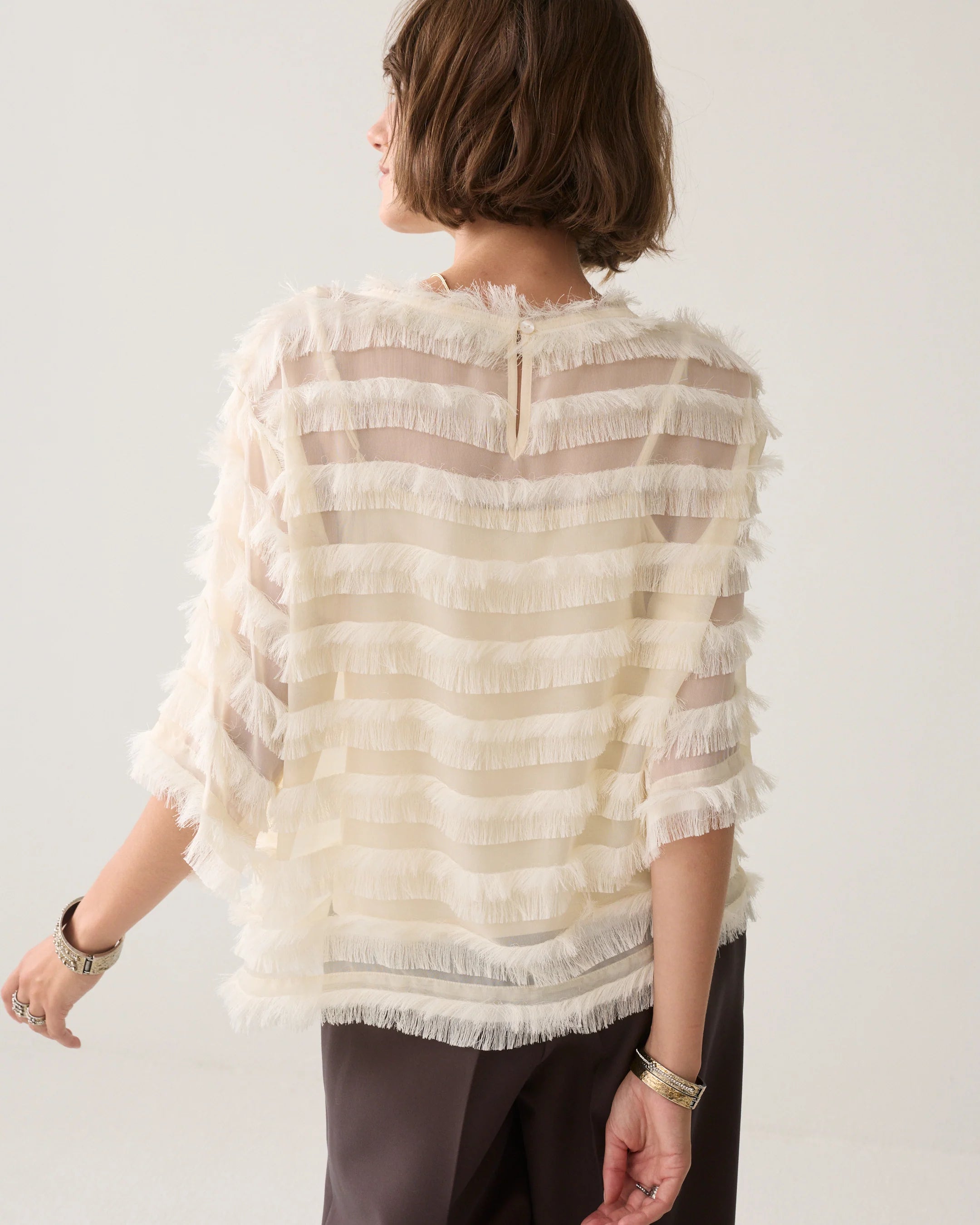 Summum cream fringed top back view with button fastening