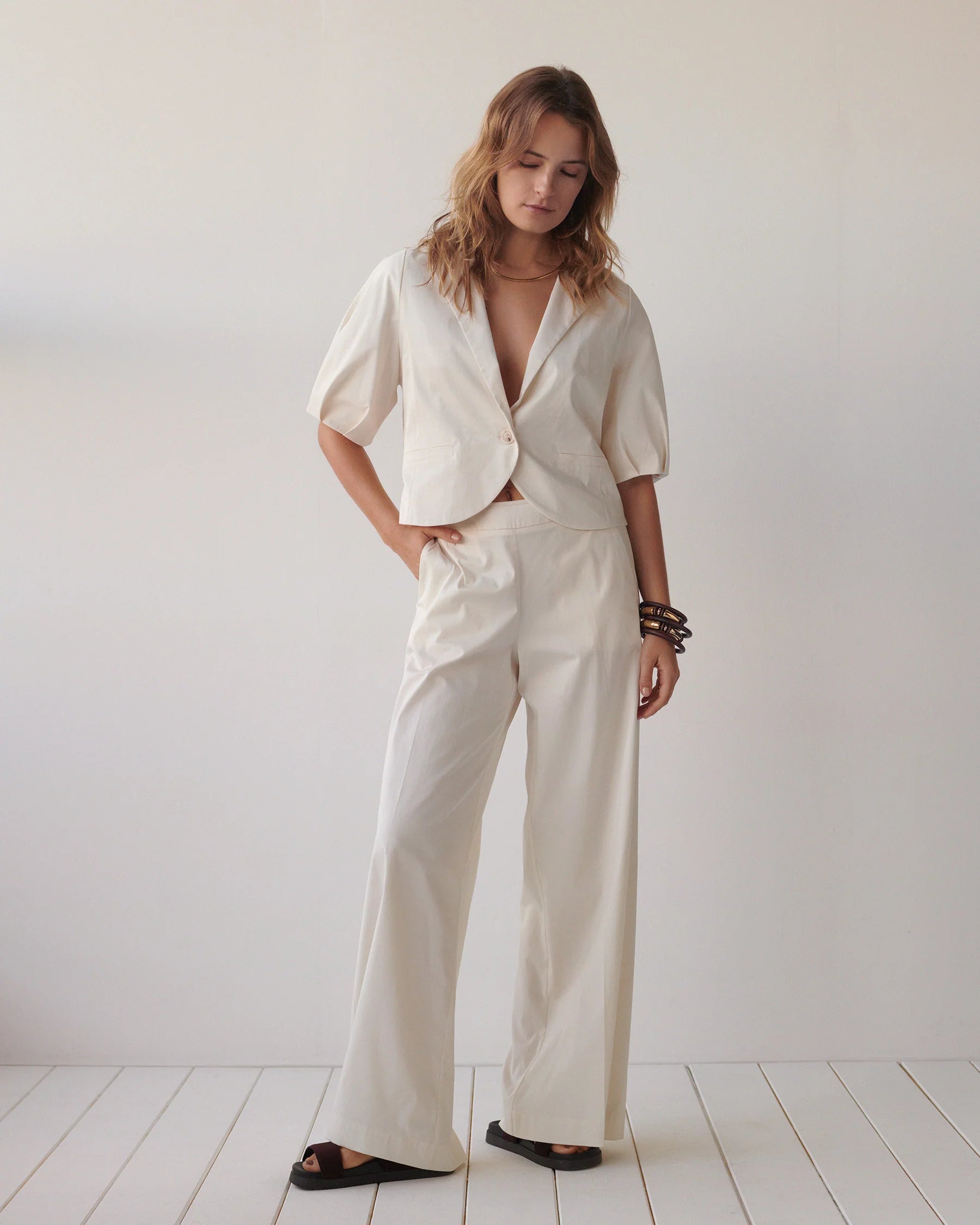 Summum cream wide trousers styled with matching jacket
