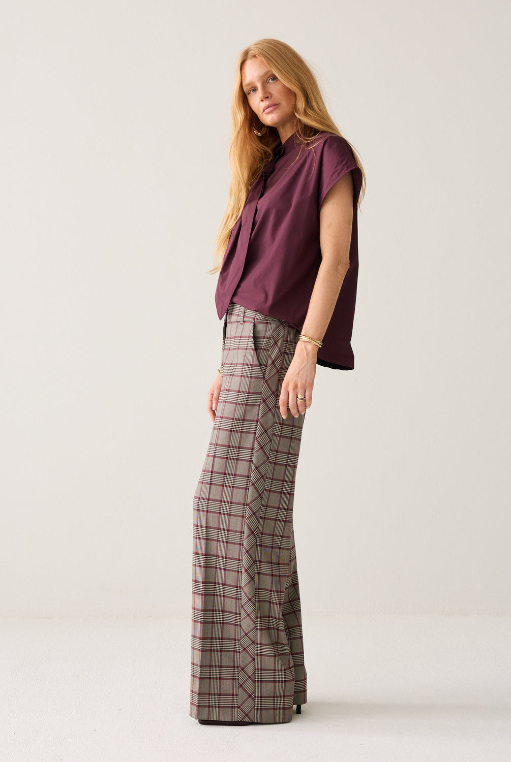 Summum check wide leg trousers side view with burgundy bow blouse