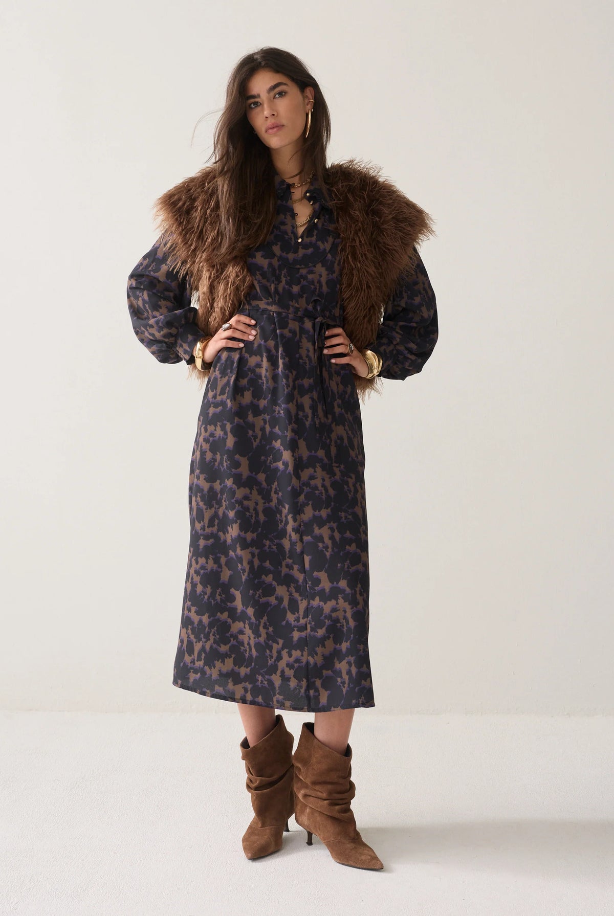 Summum black camouflage midi dress styled with brown faux-fur gilet and boots – full model view