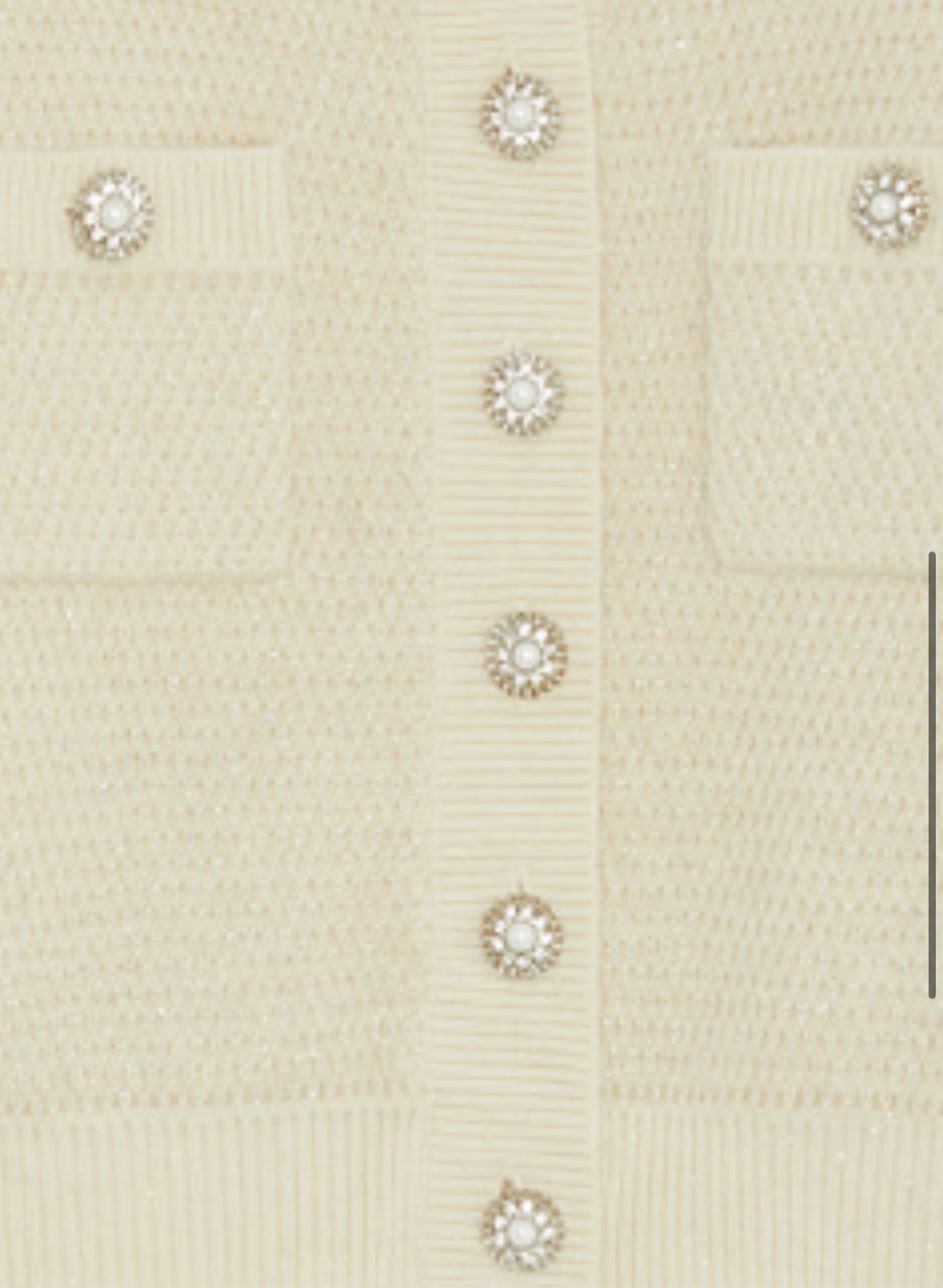 Close-up of pearl and crystal button detail on Suncoo cardigan