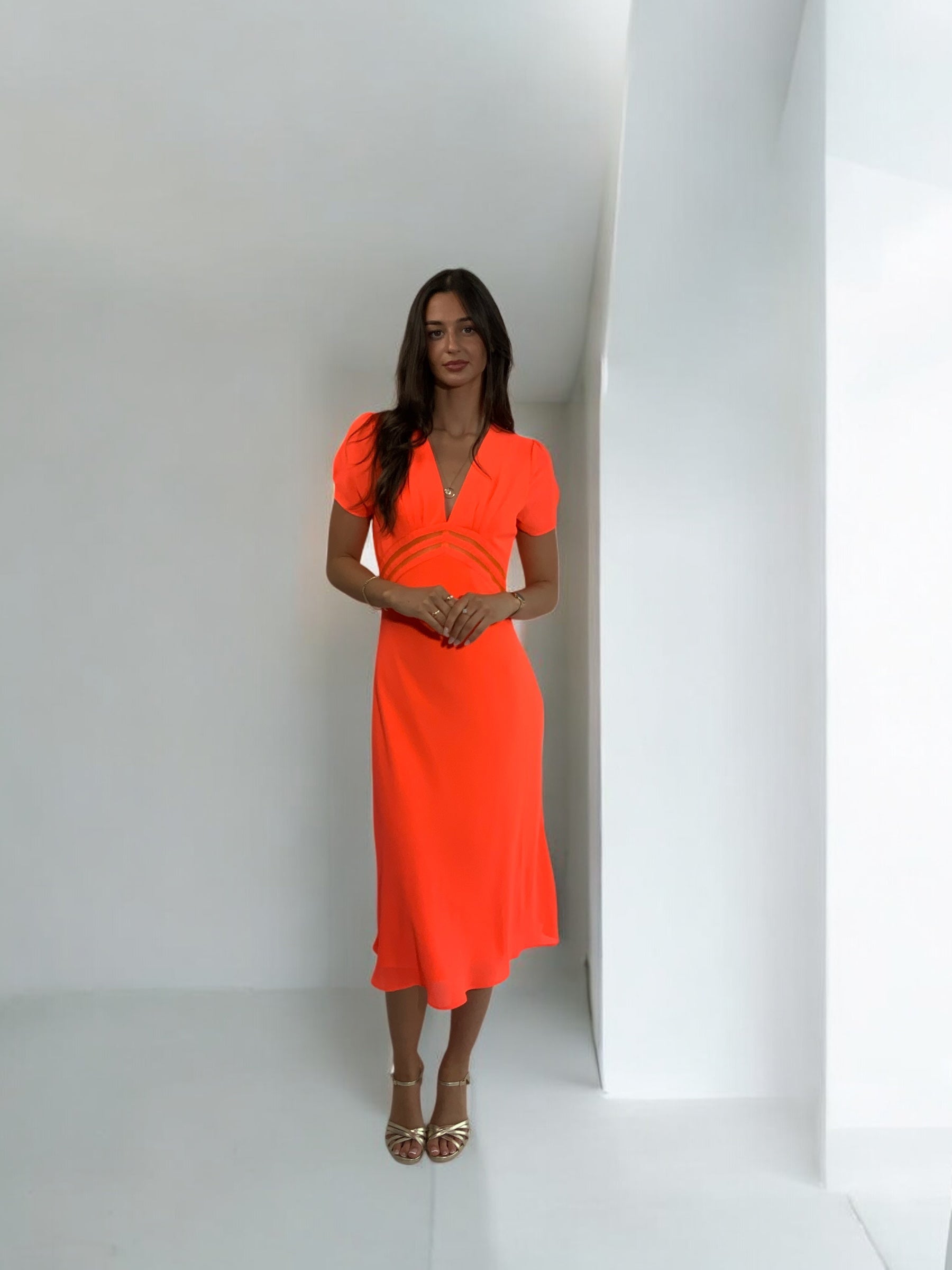 Girls Curiosity Tethys orange midi dress full length studio shot