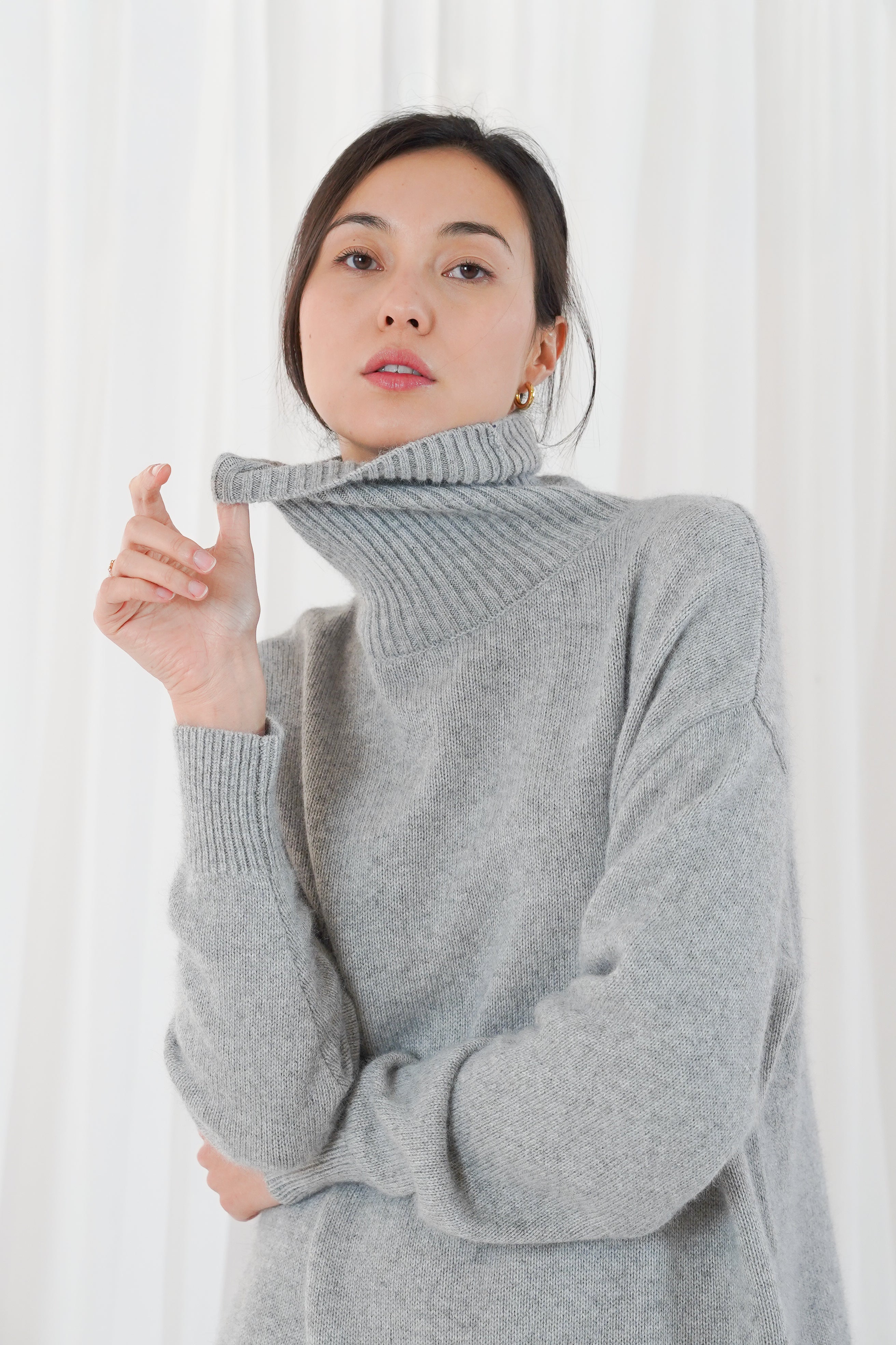 Close-up of Twins Greeley grey turtle neck jumper and ribbed collar