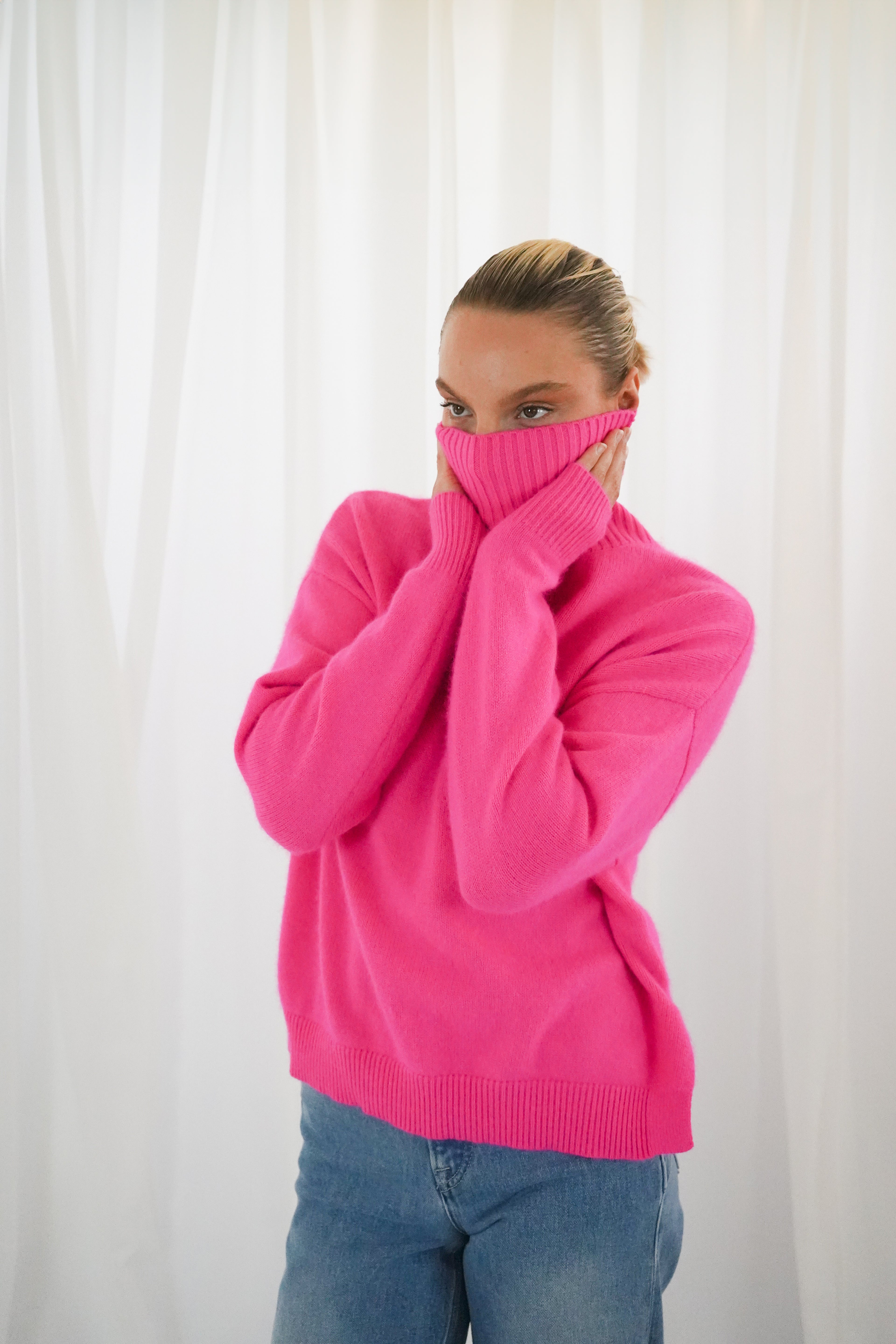 Twins Greeley neon pink relaxed roll neck jumper front view