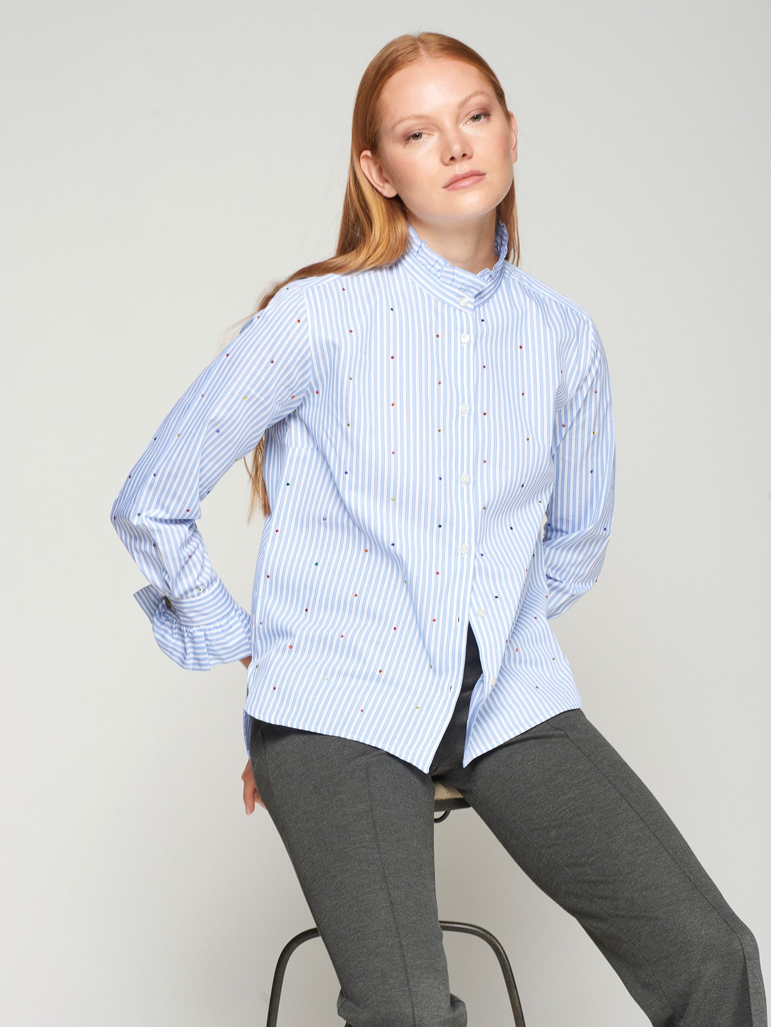 Close-up of Vilagallo cotton pinstripe shirt with scattered stud embellishment.