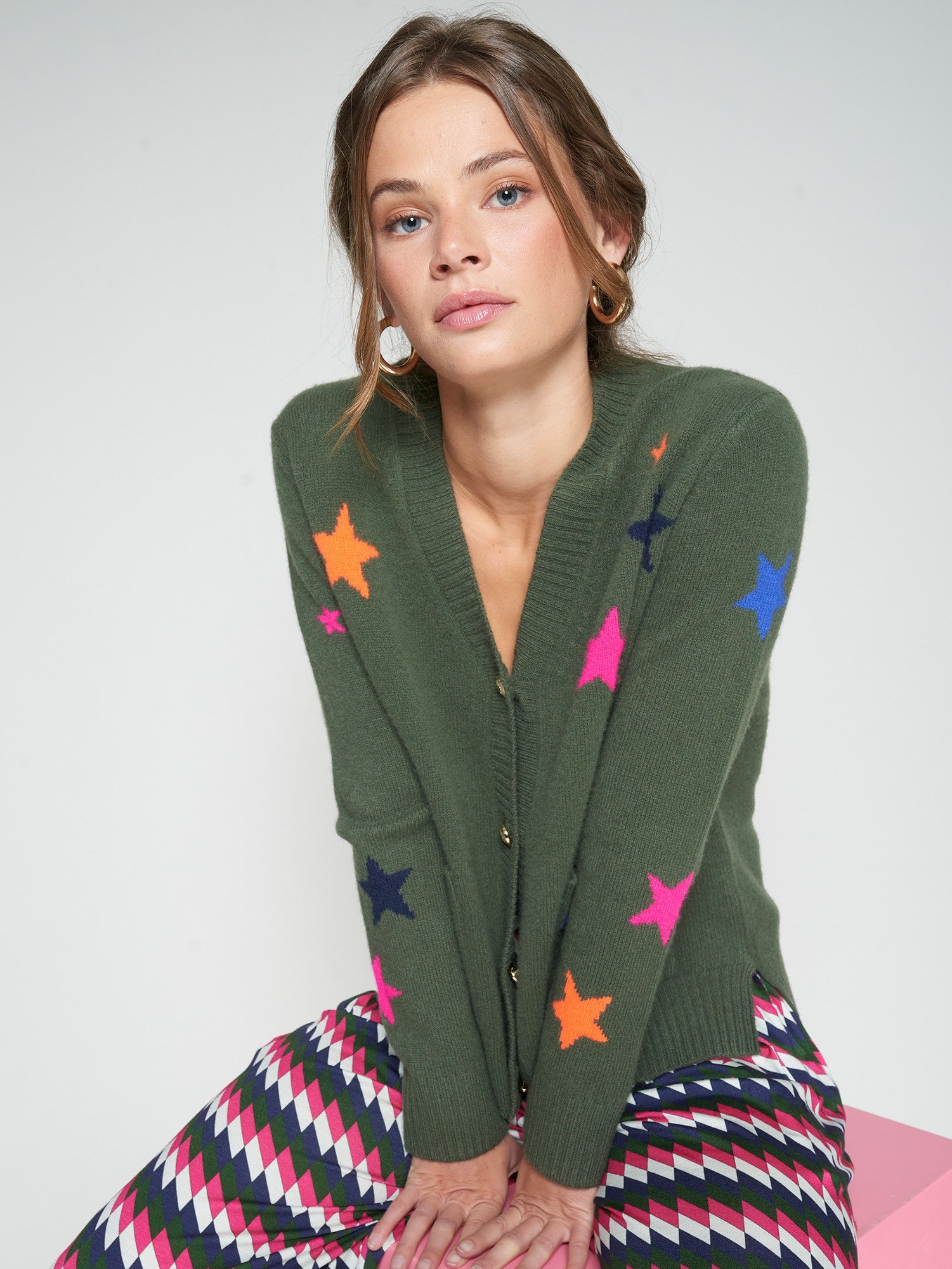 Vilagallo green women’s wool cardigan with neon pink and orange stars