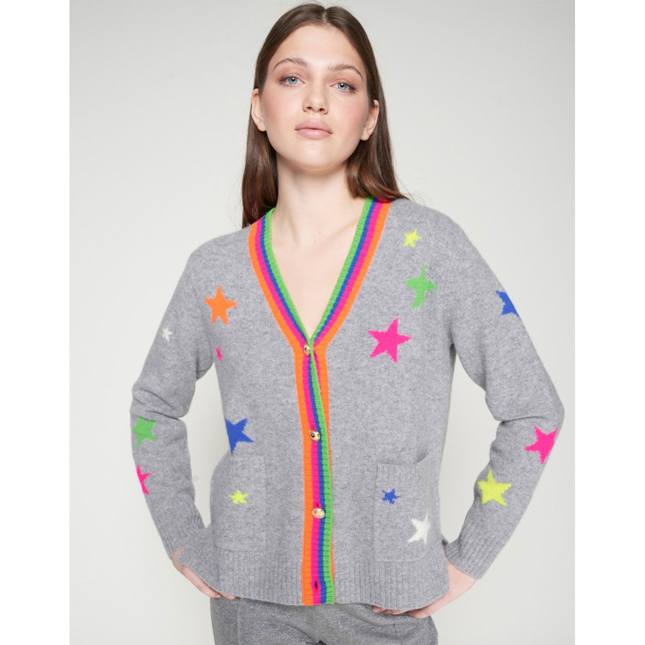 Model wearing Vilagallo Alina grey cardigan with neon star details