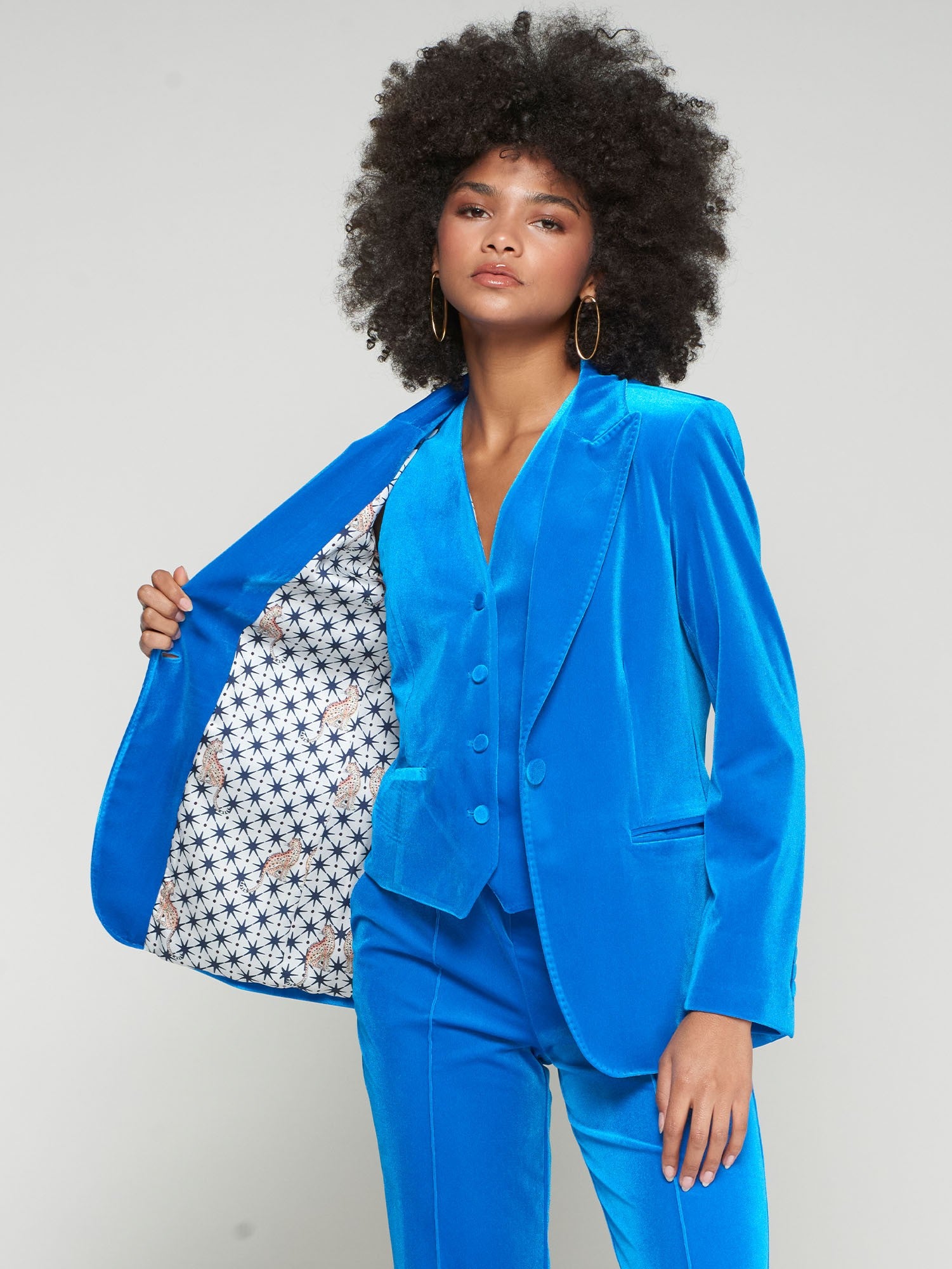 Vilagallo Heather blazer opened to reveal star-leopard print inner lining in contrasting tones