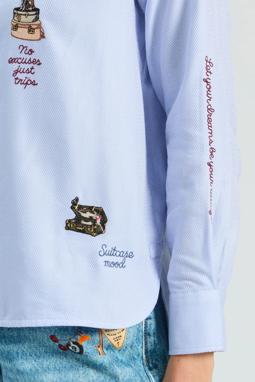 Vilagallo Hotel blue striped shirt with colourful travel embroidery and slogan detail – close-up view