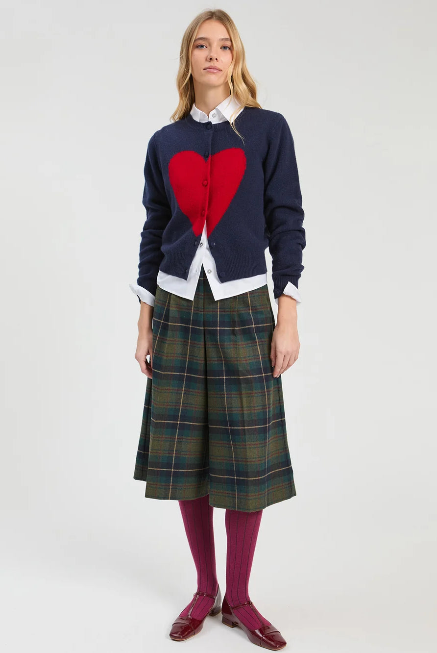 Vilagallo navy red heart cardigan styled with white shirt and checked skirt – full model view