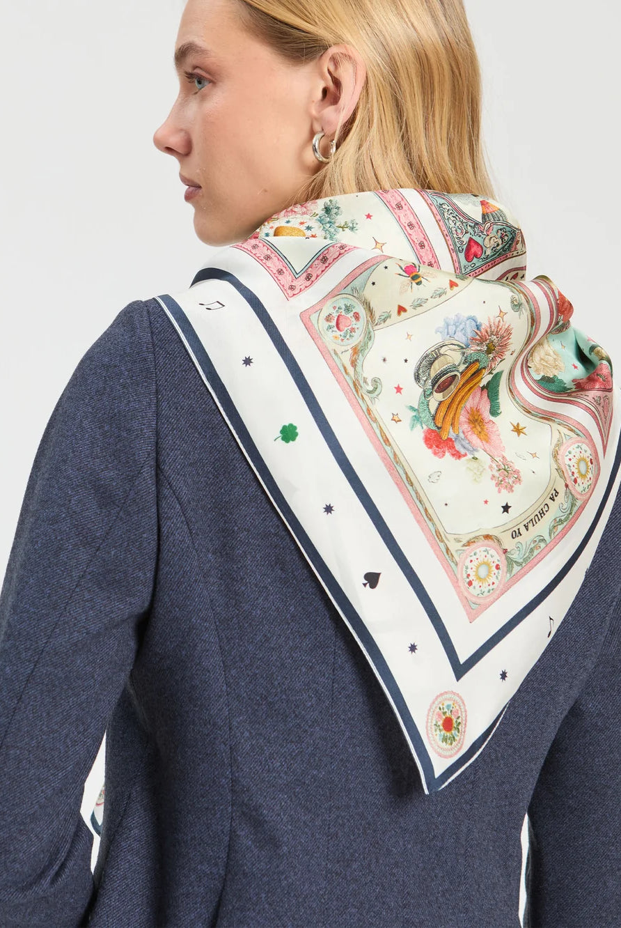 Vilagallo Madrid illustrated silk scarf styled around the shoulders