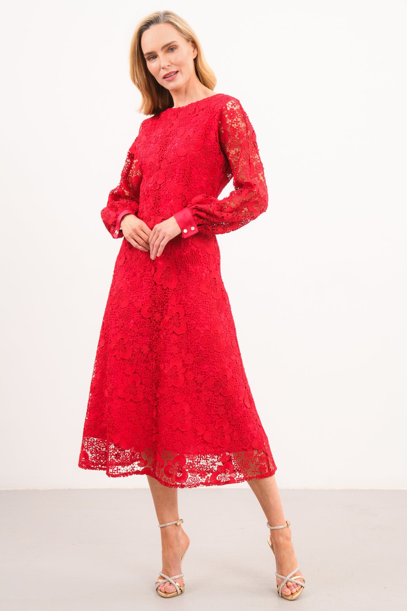 Caroline Kilkenny Iris red lace occasion dress shown at an angle