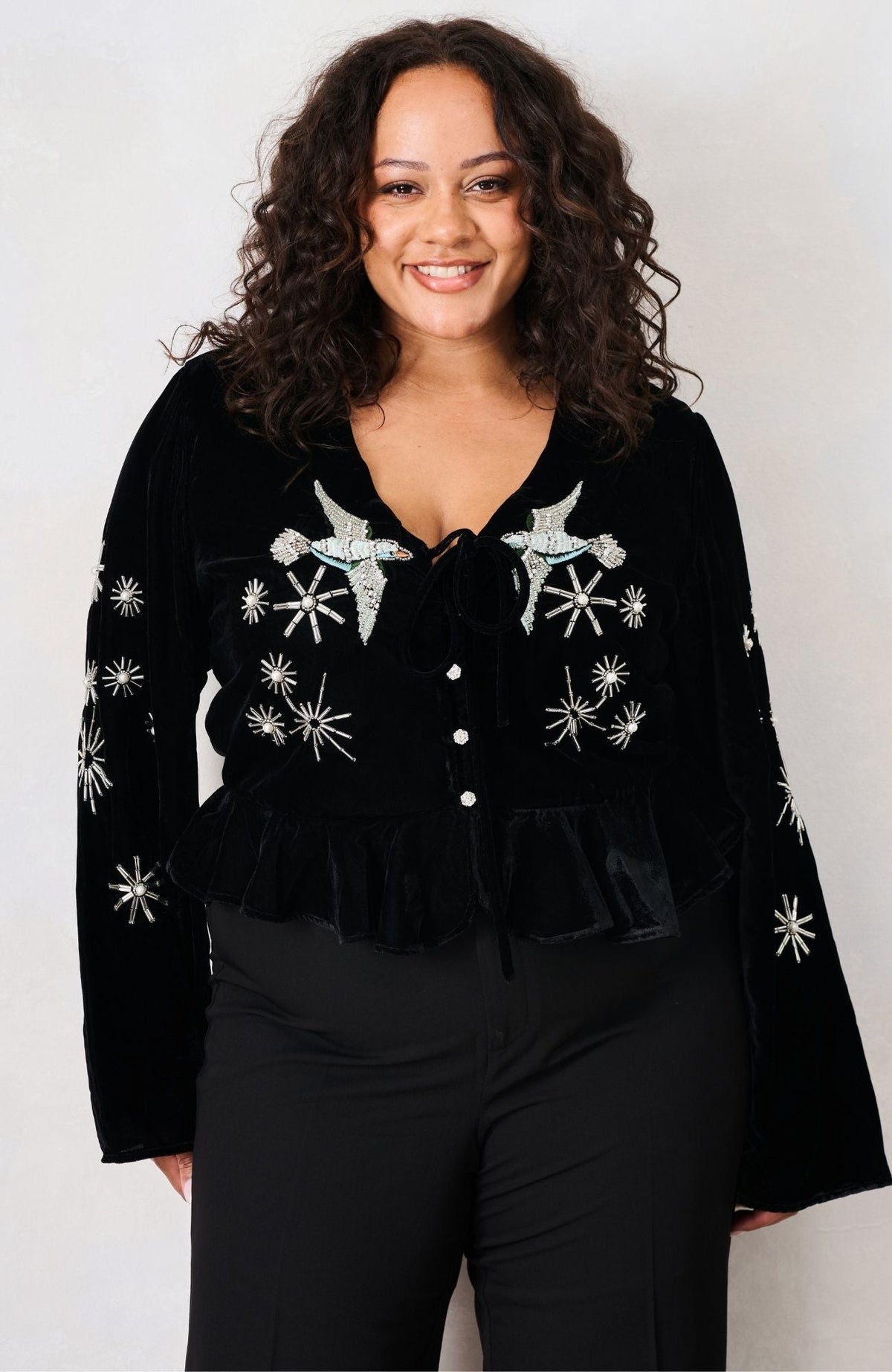 Hope & Ivy Glacia black velvet bird embellished top – front curve model view
