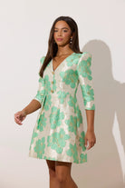 8th Sign Veronica floral mini dress side view showing flared bell skirt