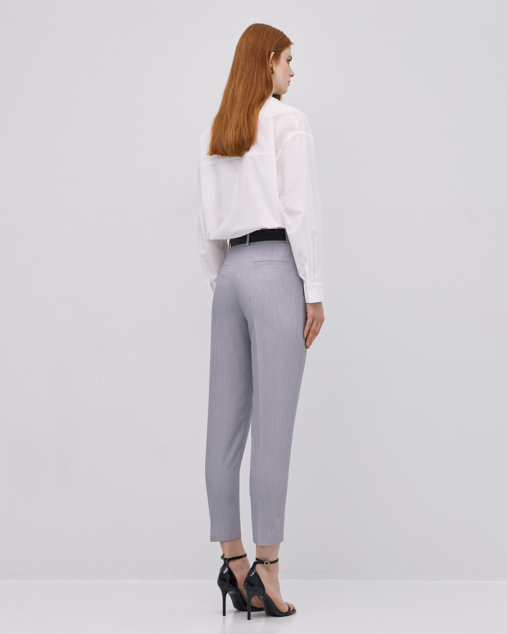 Back view of Access Fashion grey tailored trousers with clean finish