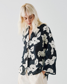Access Fashion floral blouse styled with tailored trousers for smart-casual look