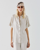 Access Fashion Button-up metallic shirt styled with matching high-waisted trousers