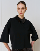 Access Fashion black top with detachable sequin collar and wide 3/4 sleeves, front view on model.