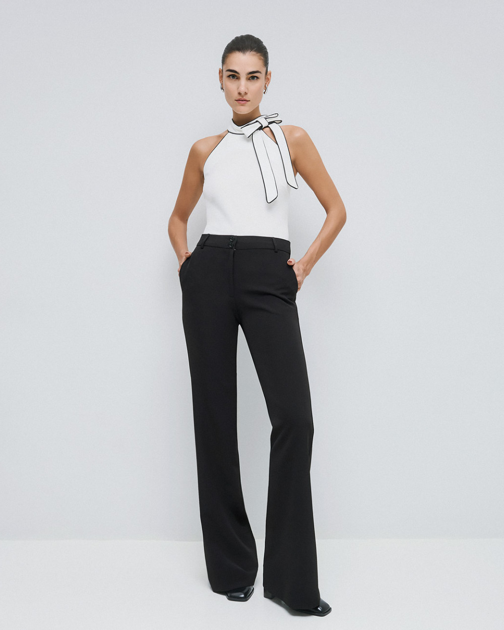 Access Fashion high waisted black flared trousers front view.