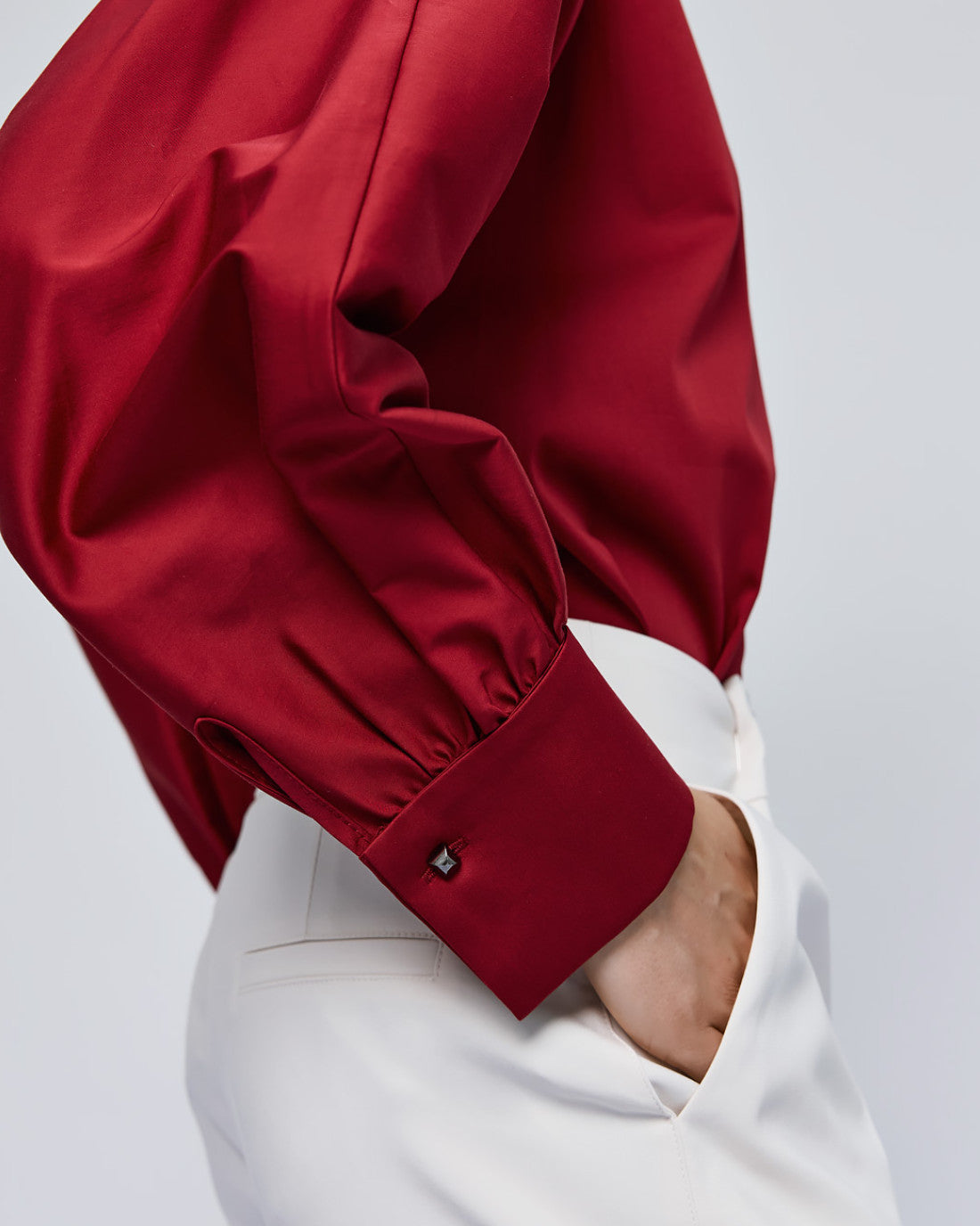 Back of Access Fashion red shirt with long sleeves and cuff detail