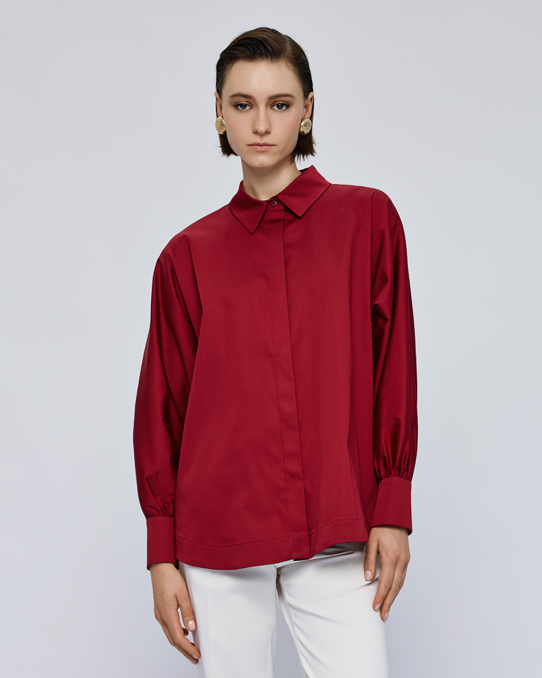 Access Fashion red shirt cuff with button detail close-up