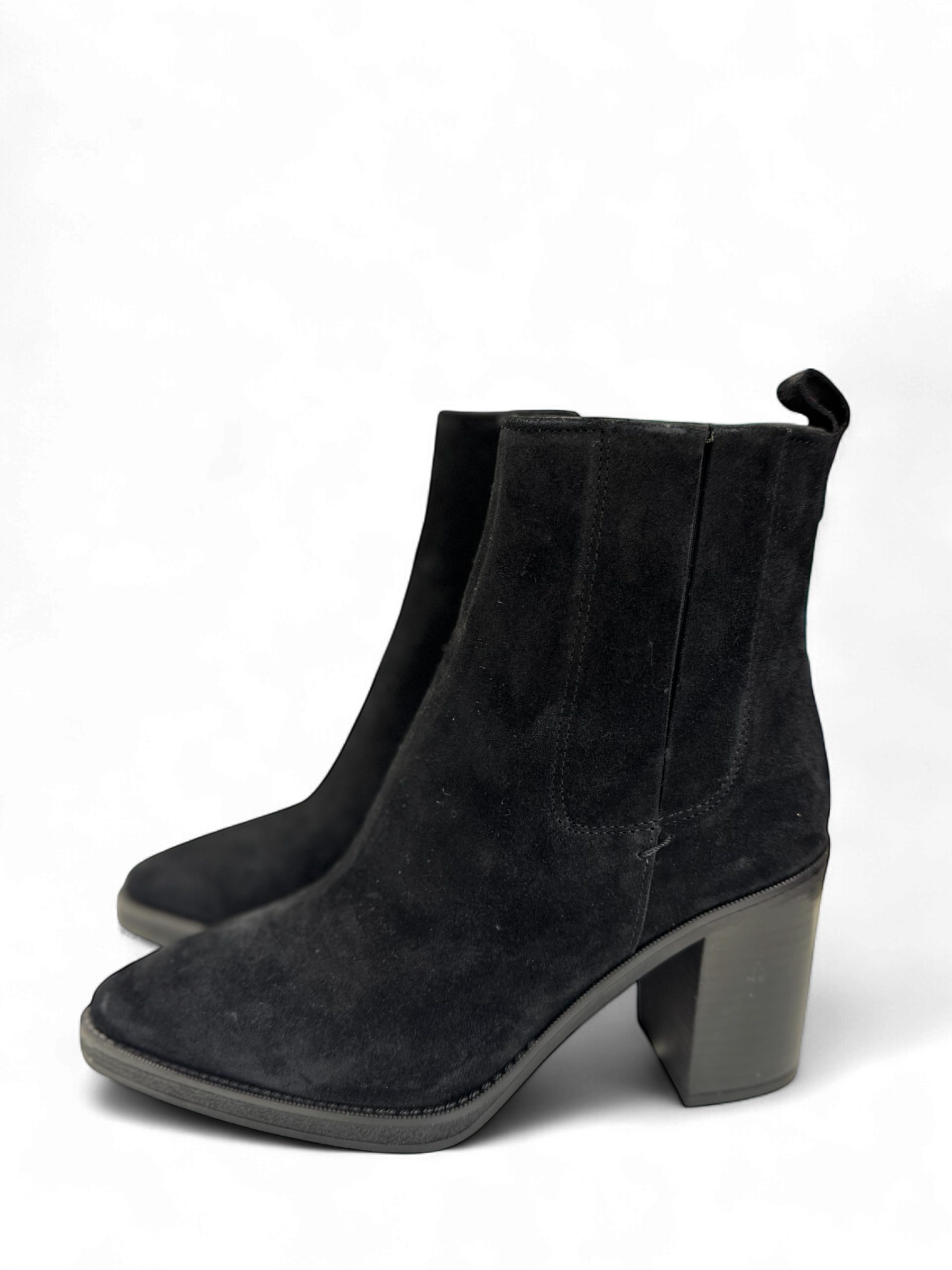 Side angle of women’s black suede ankle boots with elastic sides