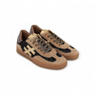 Side view of tan suede trainers with bronze heel and rubber sole