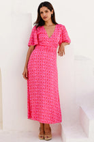 Aspiga Mimi pink print flutter sleeve midi dress front view