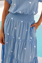 Aspiga Riley embroidered cotton midi dress side view of pockets and tiered skirt