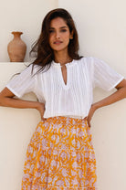 Aspiga Vienna white embroidered cotton blouse styled with midi skirt 