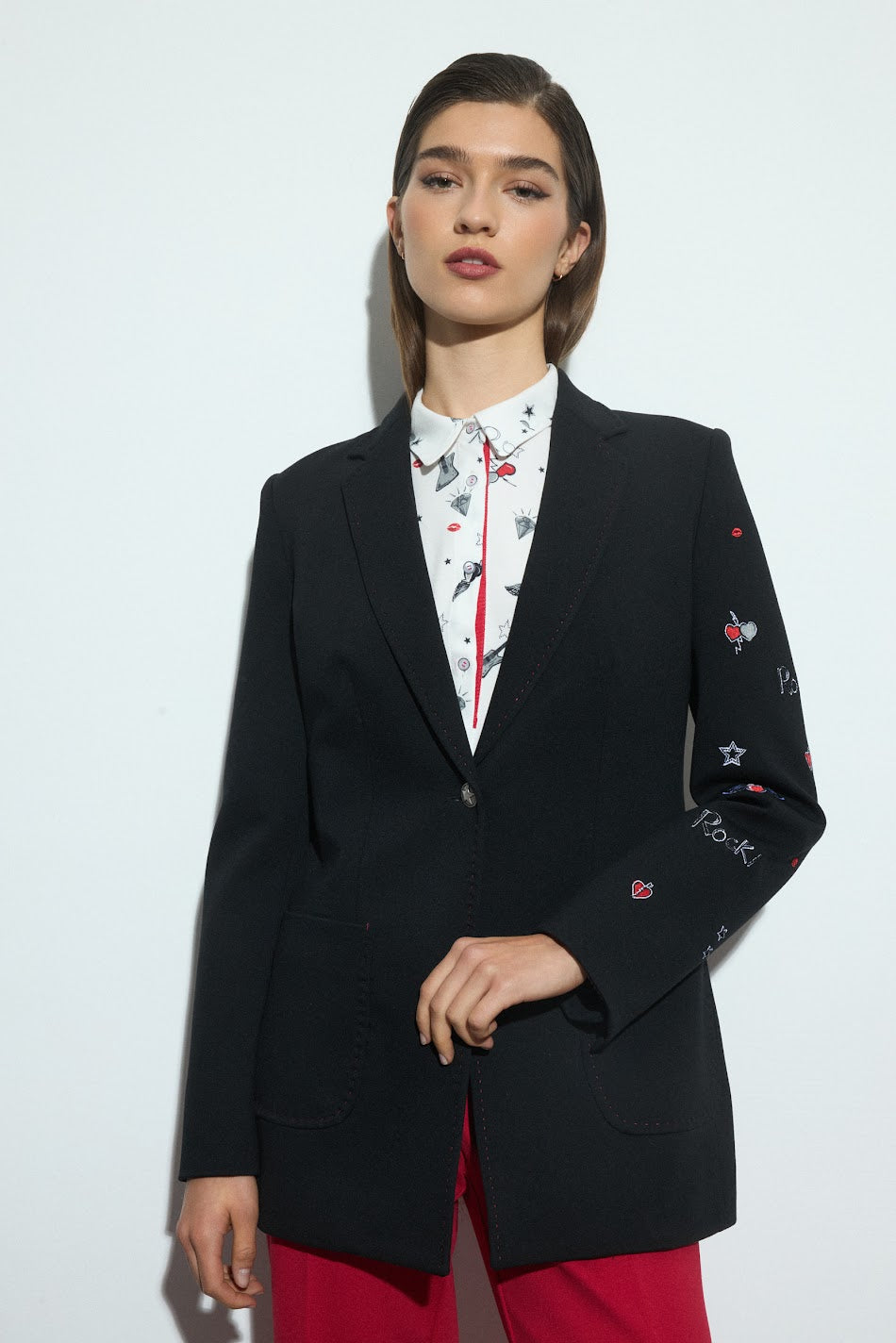 Bariloche Ira black blazer with embroidered rock motifs On one sleeve 
