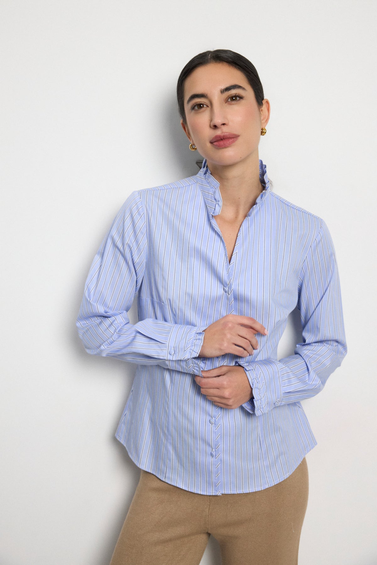 Bariloche Adrano blue pinstripe ruffle collar shirt front view on woman