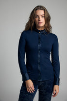 Bariloche Andria navy stretch jersey shirt – front model view showing satin trim and frill collar
