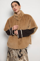 Bariloche Aris camel faux fur elbow sleeve cape coat styled on model
