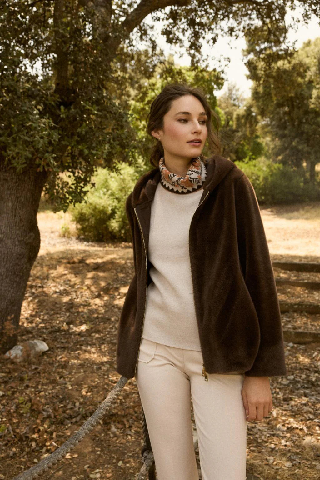 Model wearing Bariloche Calipolis faux fur bomber in outdoor setting

