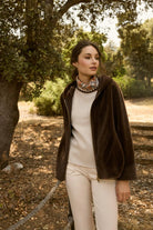 Model wearing Bariloche Calipolis faux fur bomber in outdoor setting
