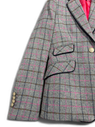 Close-up of Bariloche grey check blazer with pink accents and flap pockets