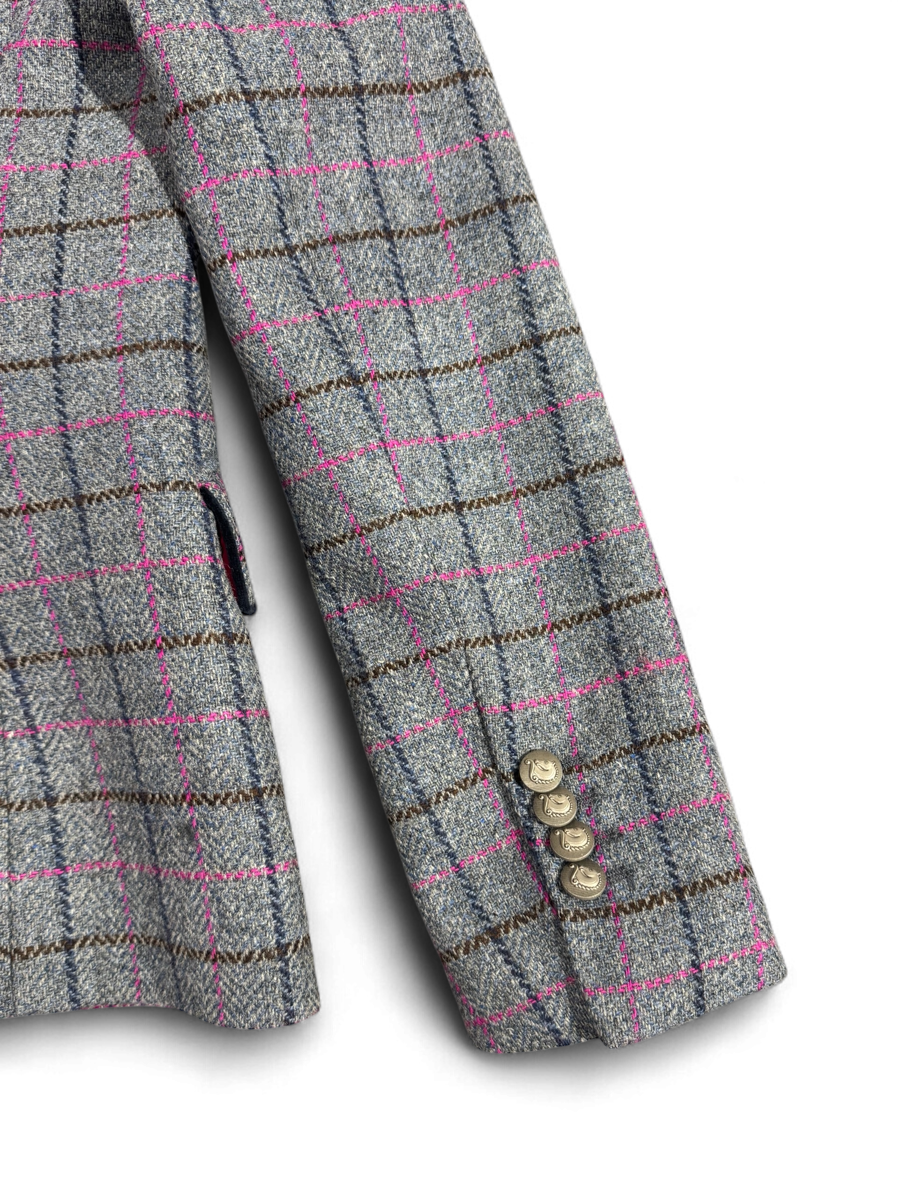 Sleeve detail of Bariloche pink and grey check blazer with statement buttons